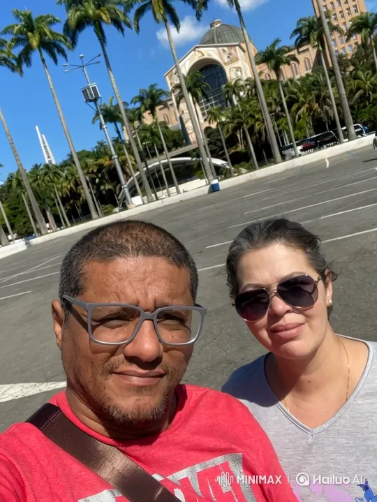 Couple Enjoying Sunny Day in Plaza with Slow Zoom-In – AI Generated Video | Hailuo AI