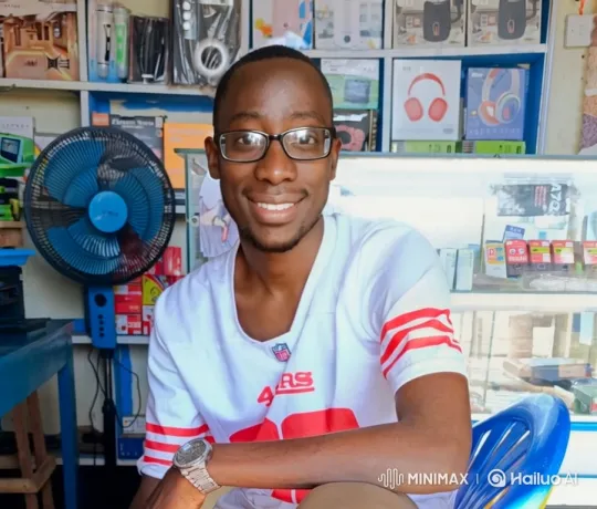Young Man in Electronics Store with Spinning Fan – AI Generated Video | Hailuo AI