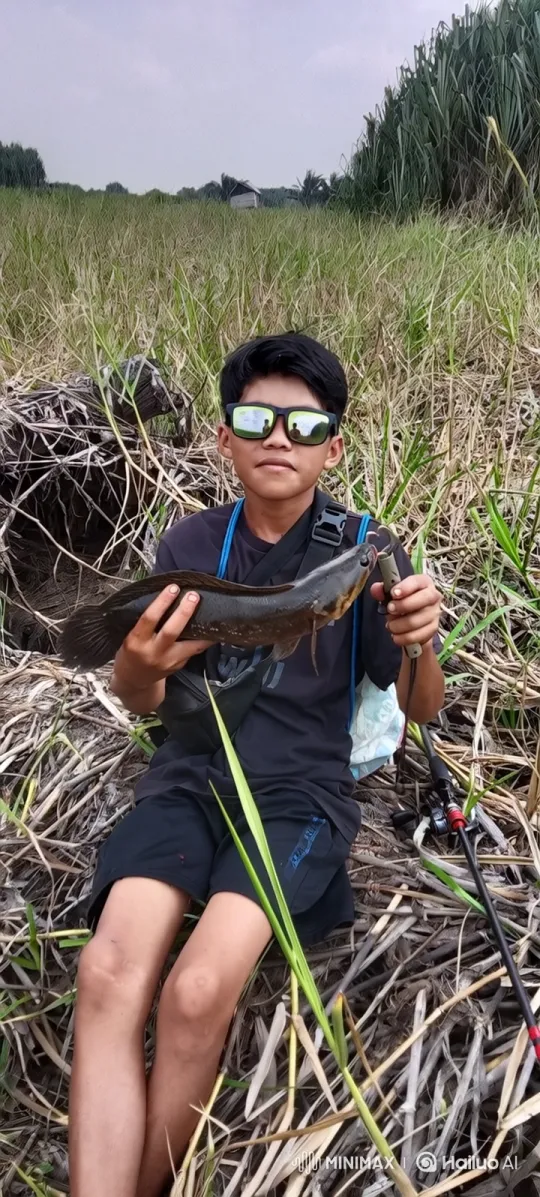 Young Boy Proudly Displays His Caught Fish – AI Generated Video | Hailuo AI
