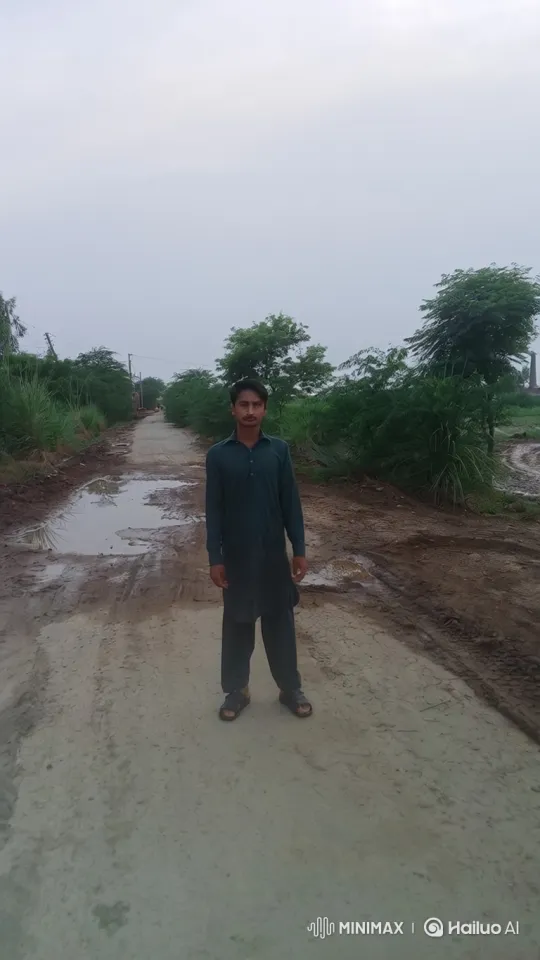 Young Man Enters Car on Rural Road Amidst Rainy Weather – AI Generated Video | Hailuo AI