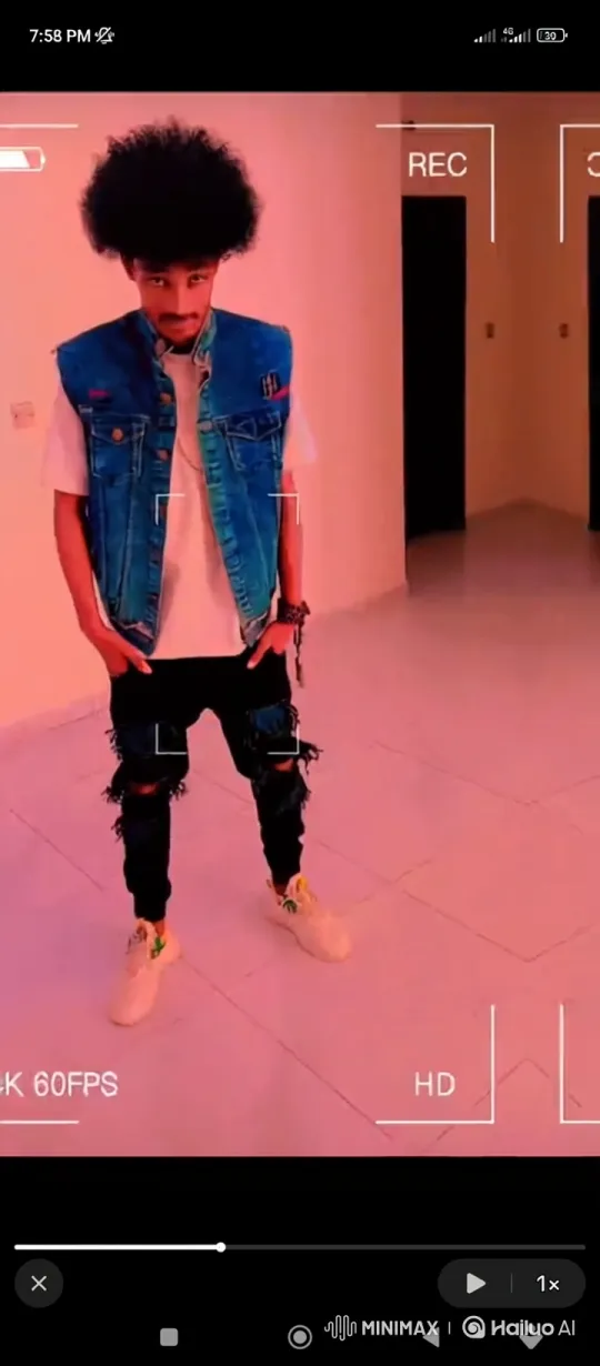 Young Man in Denim Vest Poses Confidently – AI Generated Video | Hailuo AI