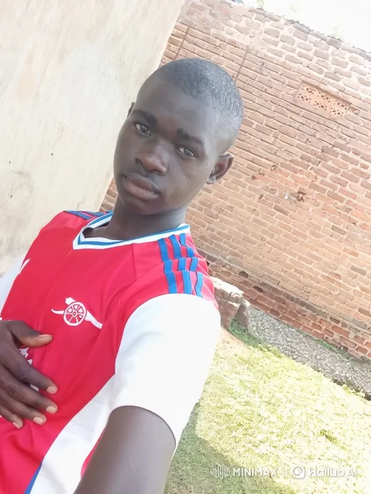Young Black Man in Red Jersey, Calm Stance – AI Generated Video | Hailuo AI