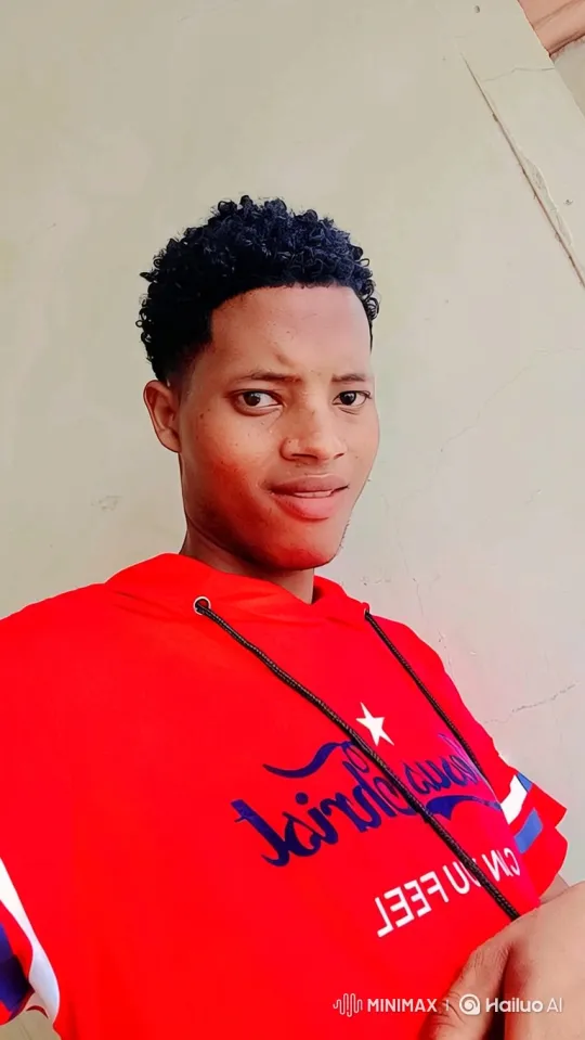 Young Man in Red Hoodie: Slow Camera Ascend and Tilt – AI Generated Video | Hailuo AI