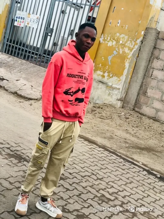 Young Black Man in Hoodie Stands Confidently – AI Generated Video | Hailuo AI
