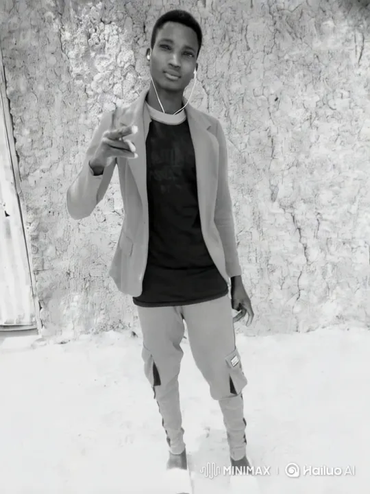 Young Man Showcases Stylish Outfit Against Rustic Wall – AI Generated Video | Hailuo AI