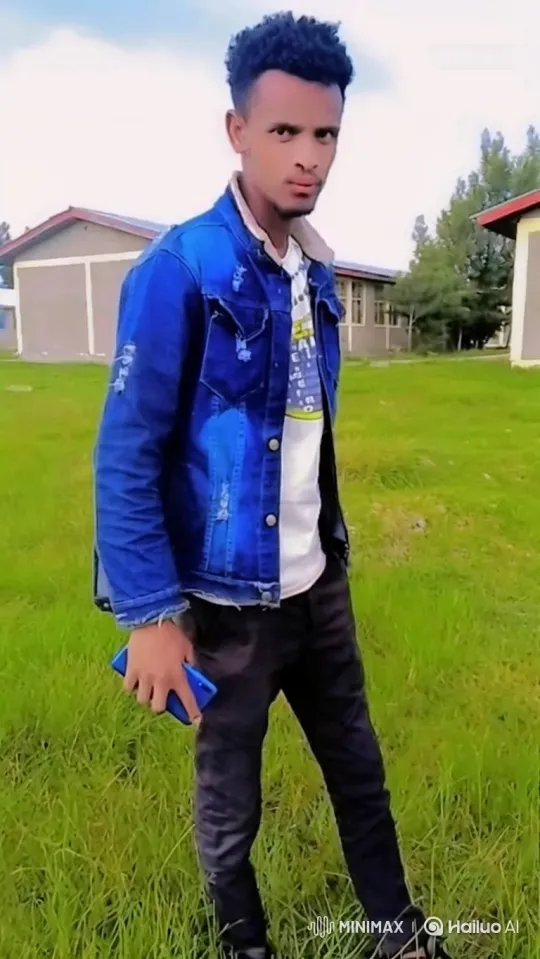 Young Man in Field With Smartphone Amidst Nature – AI Generated Video | Hailuo AI