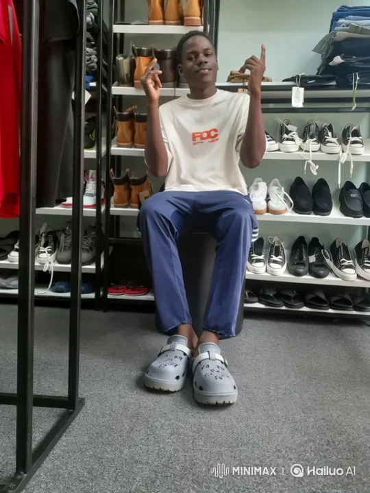 Young Man Selects Various Shoes from His Collection – AI Generated Video | Hailuo AI