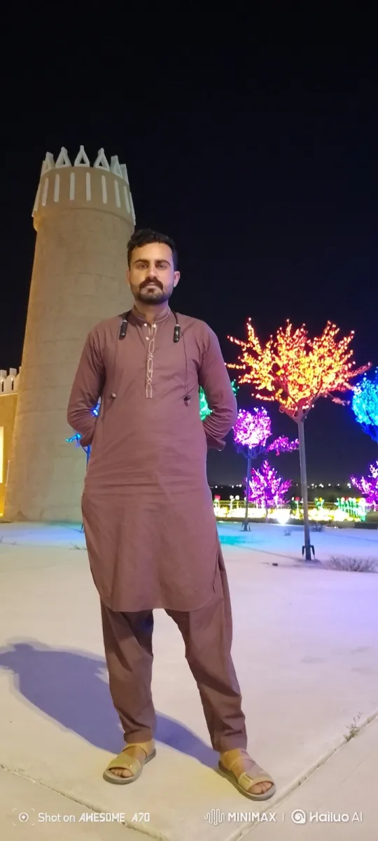 Man in Tunic Stares at Camera Amidst Nighttime Park – AI Generated Video | Hailuo AI