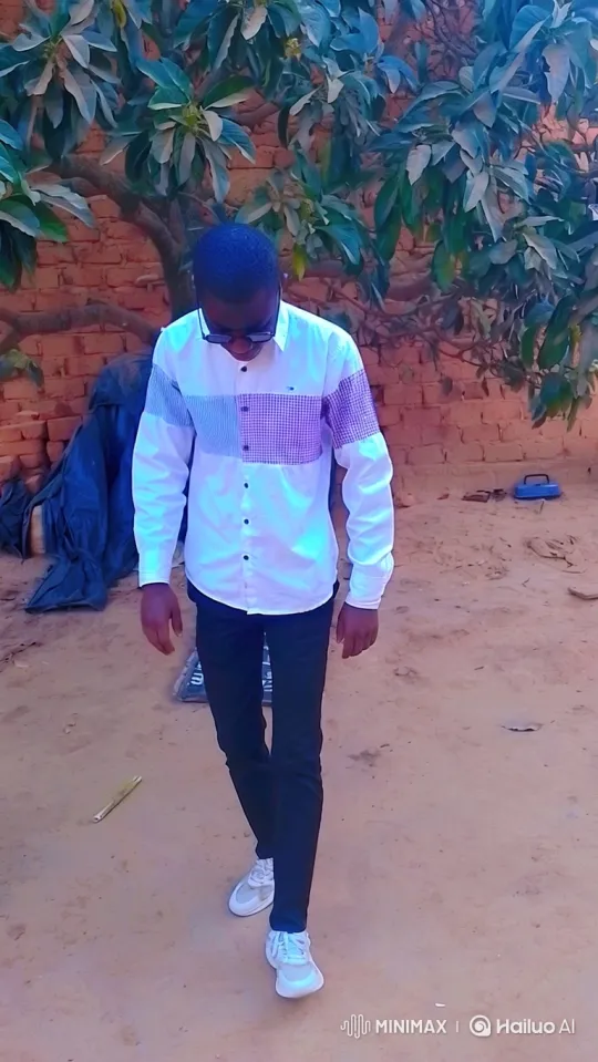 Young Man Walking Leisurely in Casual Attire – AI Generated Video | Hailuo AI