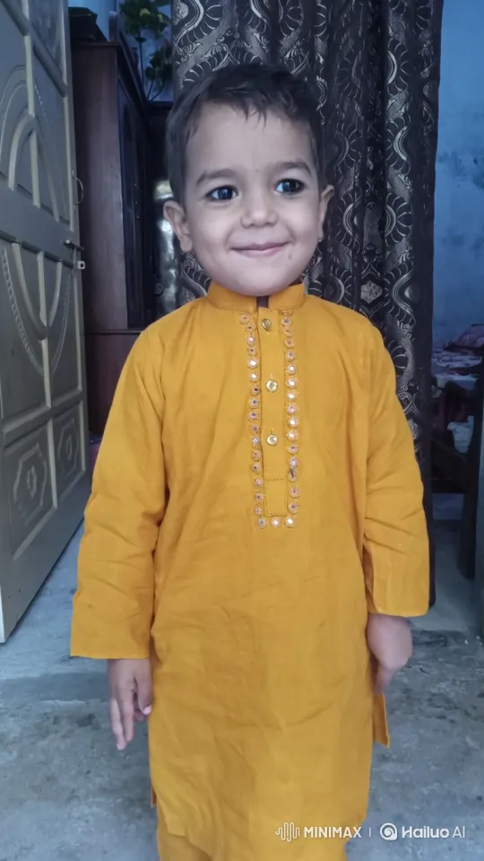Boy in Stylish Yellow Tunic: A Study in Youthful Charm – AI Generated Video | Hailuo AI