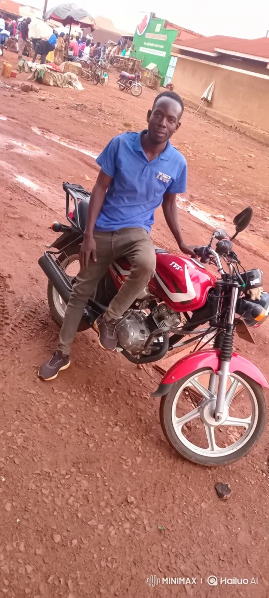 Young Man Rides Motorcycle Past Outdoor Market – AI Generated Video | Hailuo AI