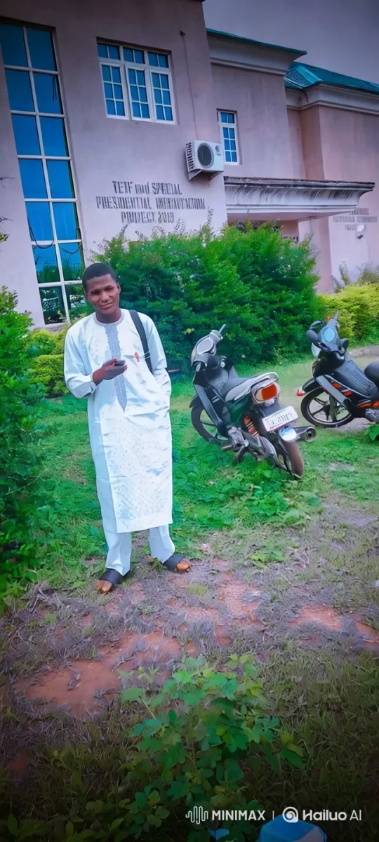 Young Man in Traditional Attire at TETF Building – AI Generated Video | Hailuo AI