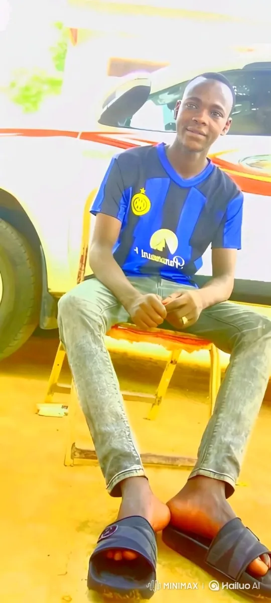 Young Man Smiles at Camera in Sunny Outdoor Setting – AI Generated Video | Hailuo AI