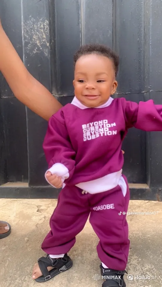 Adorable Toddler's Joyful Moment in Front of Gate – AI Generated Video | Hailuo AI