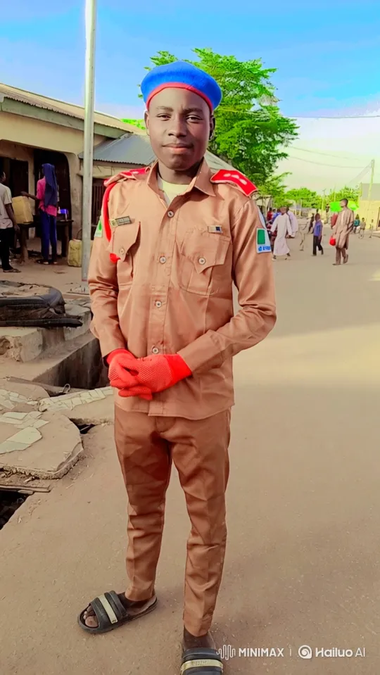 Young Man in Uniform Stands Confidently on Dirt Road – AI Generated Video | Hailuo AI