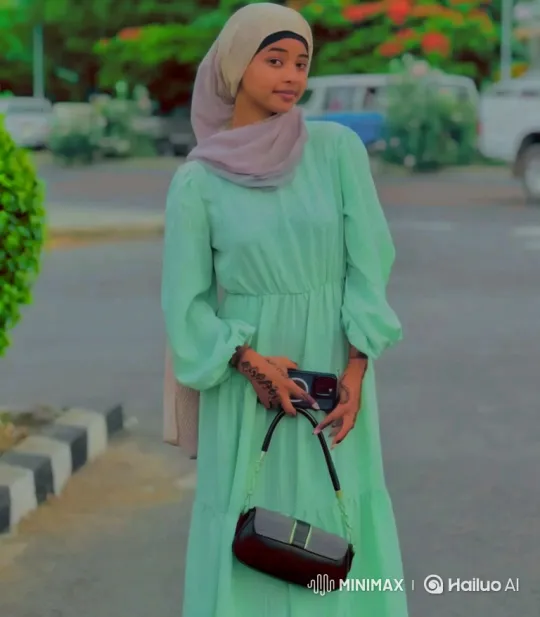 Woman in Green Dress Walks Gracefully on Paved Area – AI Generated Video | Hailuo AI