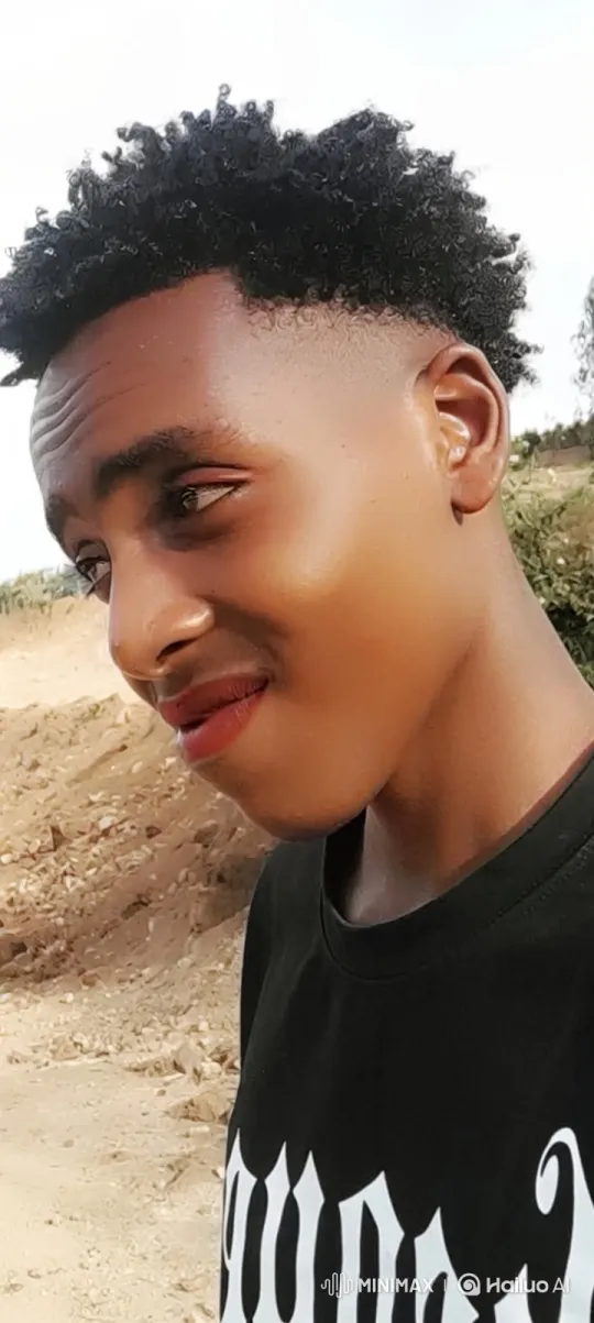 Young Black Man Smiles Thoughtfully Towards Camera – AI Generated Video | Hailuo AI
