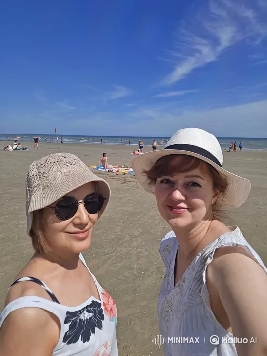 Beach Serenity: Two Women Enjoy a Sunny Day – AI Generated Video | Hailuo AI
