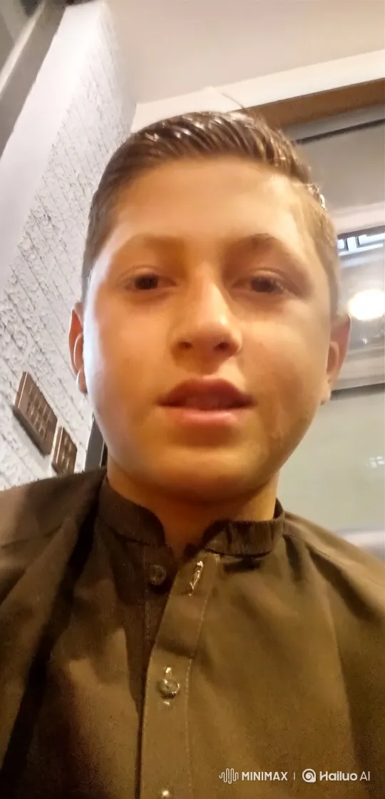 Young Boy in Barbershop with Minimal Facial Movements – AI Generated Video | Hailuo AI