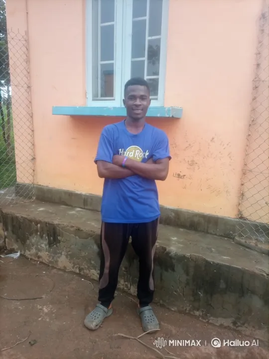 Young Man in Blue Shirt Greet with Smile – AI Generated Video | Hailuo AI
