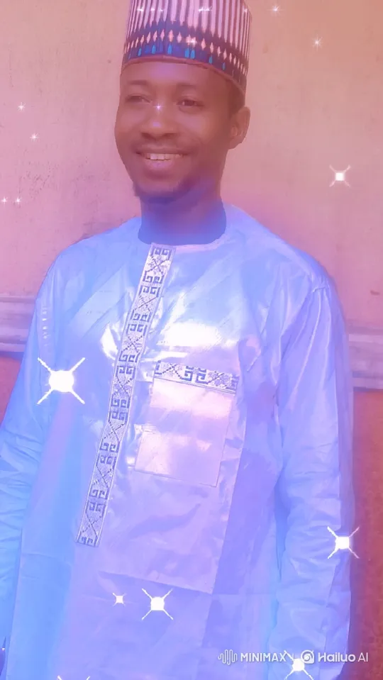 Warmly Smiling Man in Embroidered Tunic Amidst Sparkling Light – AI Generated Video | Hailuo AI