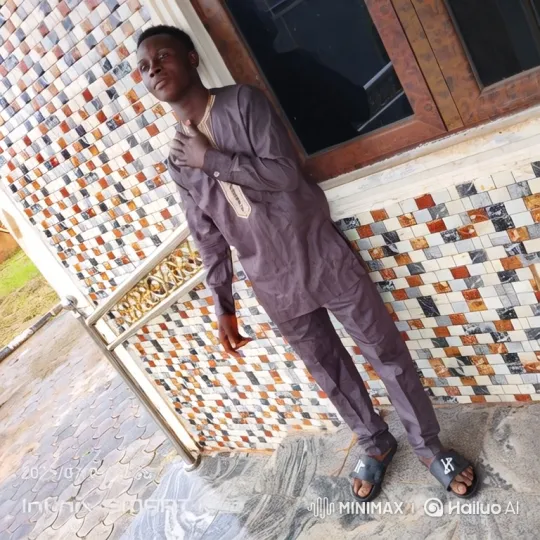 Young Man Walks Across Patterned Patio – AI Generated Video | Hailuo AI