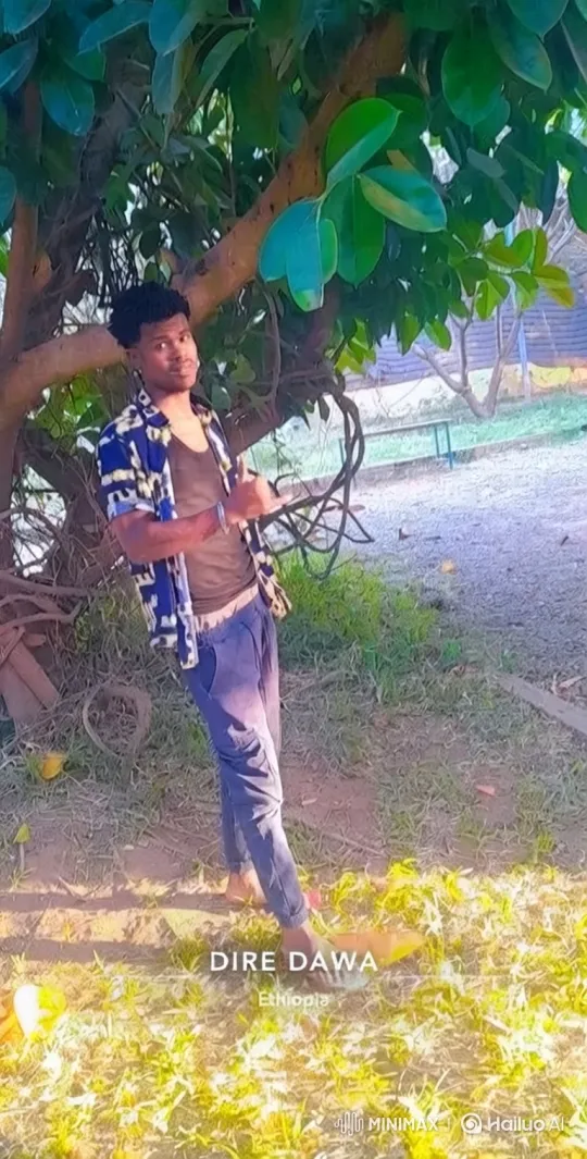Young Man in Park with Dappled Sunlight – AI Generated Video | Hailuo AI