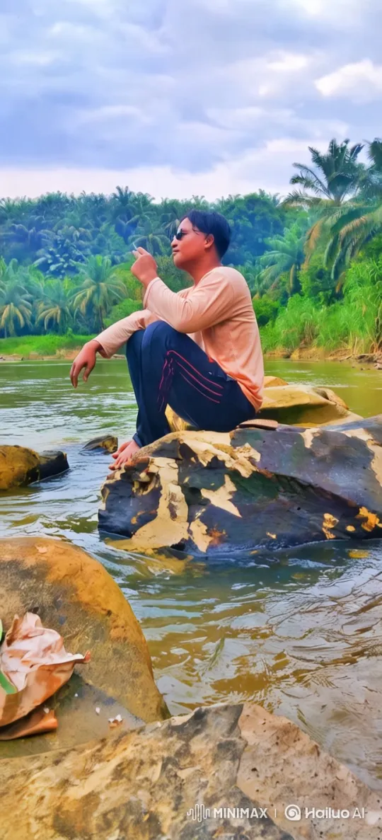 Man Reflects by River Amidst Nature's Serenity – AI Generated Video | Hailuo AI