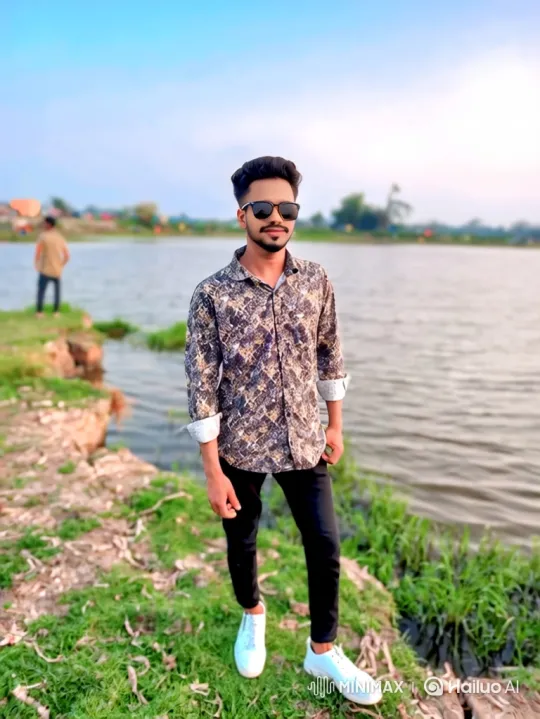 Young Man Smiles by Serene Lakeside – AI Generated Video | Hailuo AI