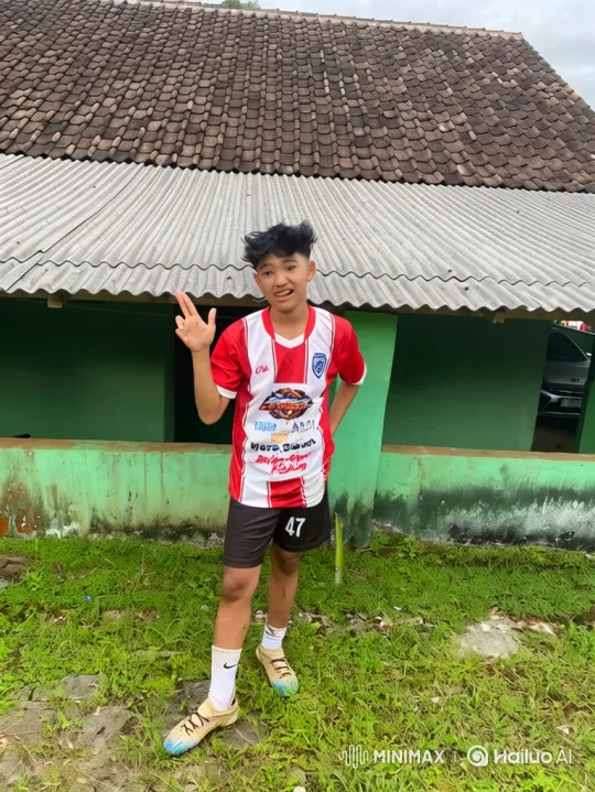 Young Person in Soccer Jersey on Green Grass – AI Generated Video | Hailuo AI