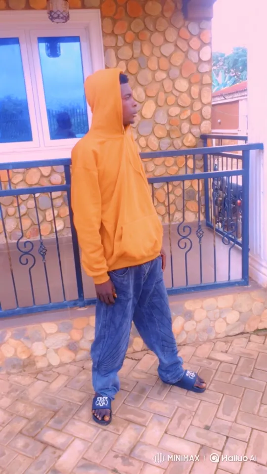 Young Man in Orange Hoodie Approaches Motorcycle – AI Generated Video | Hailuo AI