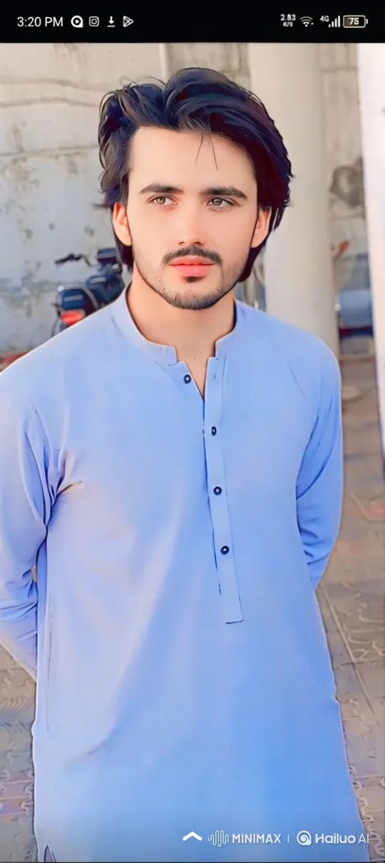 Young Man in Blue Tunic: A Study in Calm Contemplation – AI Generated Video | Hailuo AI