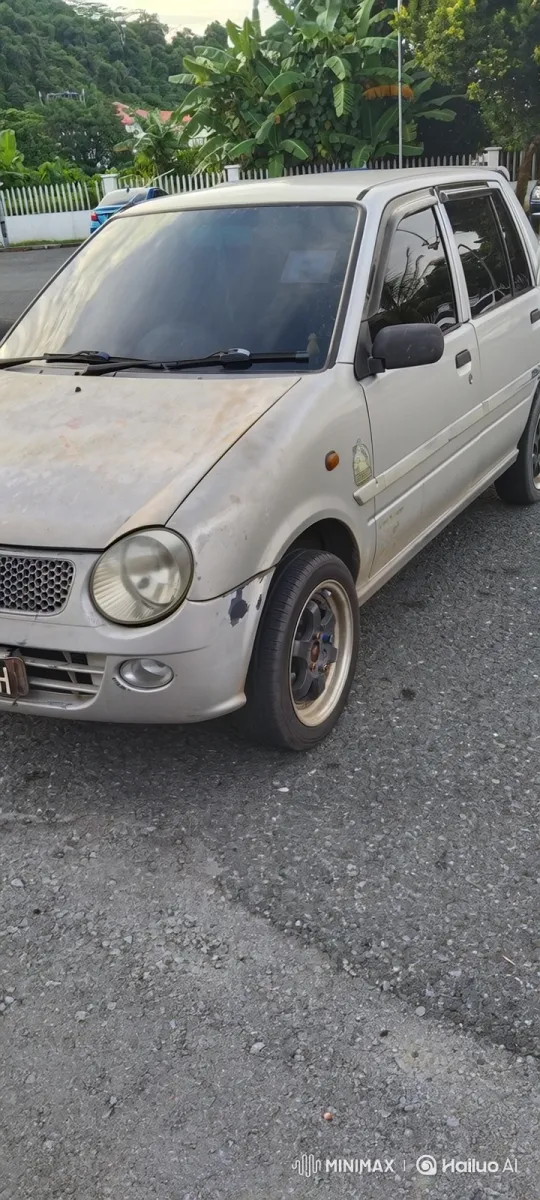 Silver Hatchback Demonstrates Simulated Air Suspension Lowering – AI Generated Video | Hailuo AI