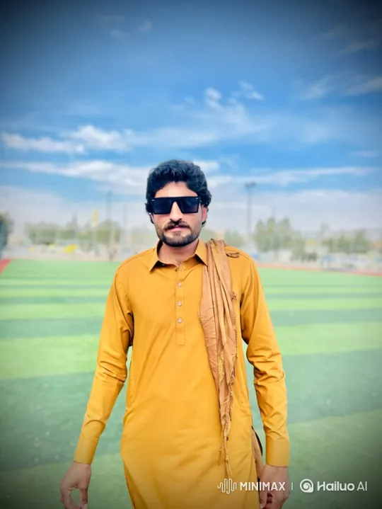 Man in Yellow Tunic Stands on Green Field – AI Generated Video | Hailuo AI