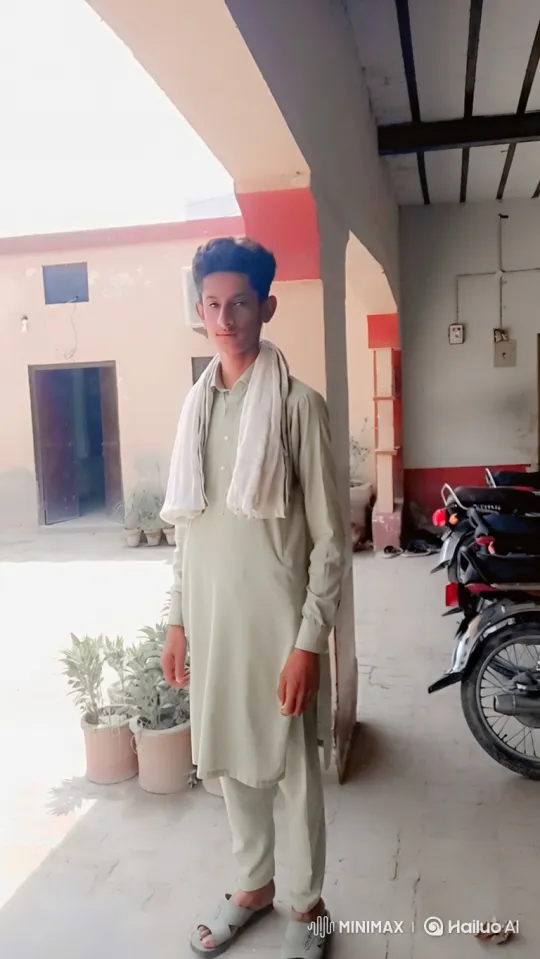 Young Man in Courtyard: Aerial Pan and Ascending Perspective – AI Generated Video | Hailuo AI