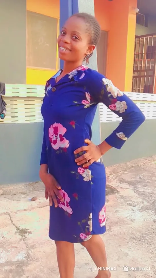 Woman in Blue Dress Poses with Genuine Smile – AI Generated Video | Hailuo AI