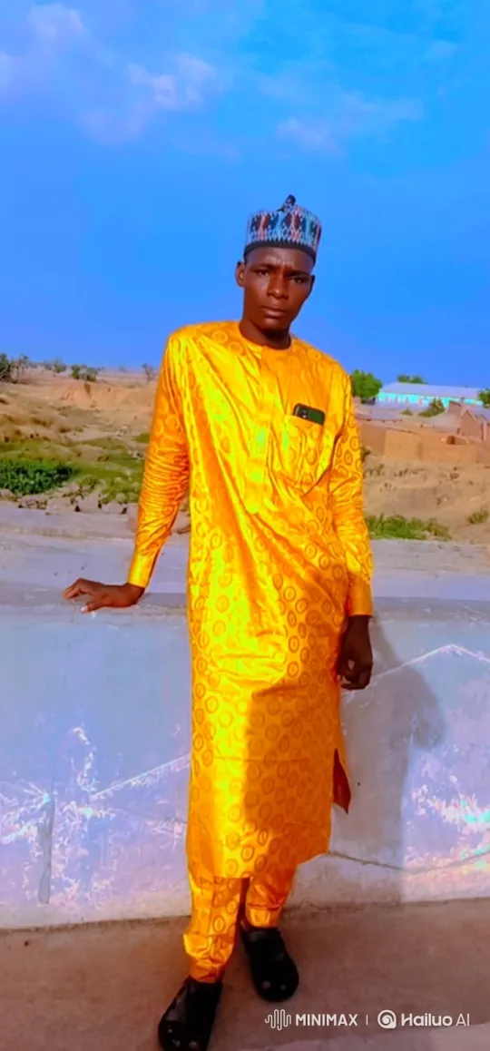 Young Man in Vibrant Yellow Attire with Gentle Smile – AI Generated Video | Hailuo AI