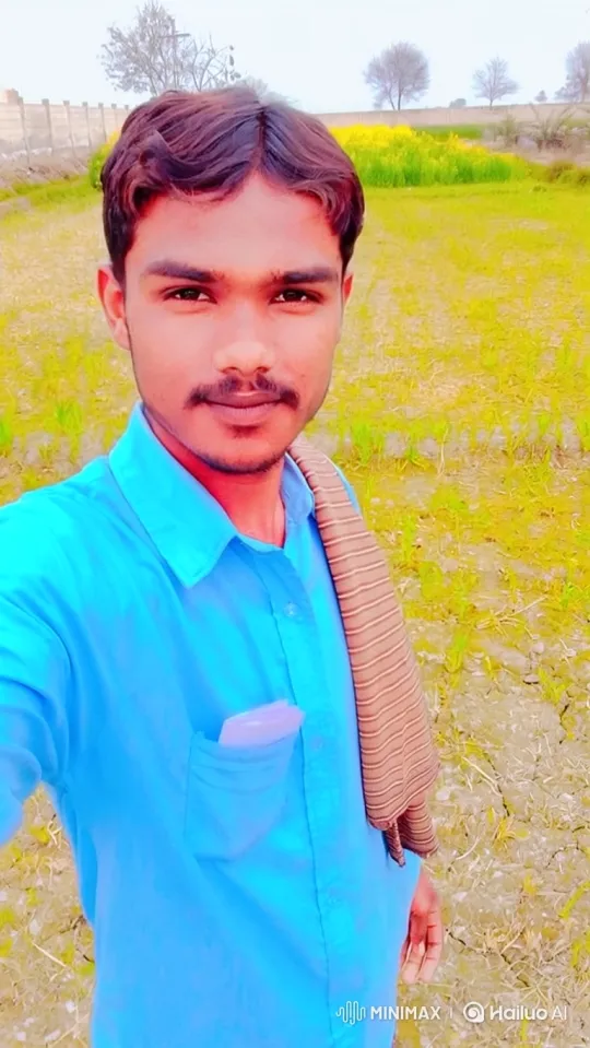 Young Man in Field: Serene Smile Amidst Gentle Breeze – AI Generated Video | Hailuo AI