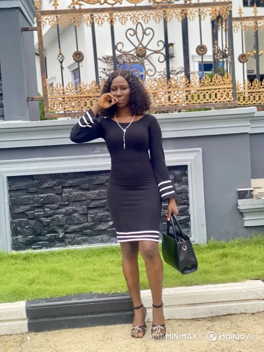 Woman in Black Dress Poses Gracefully Outdoors – AI Generated Video | Hailuo AI