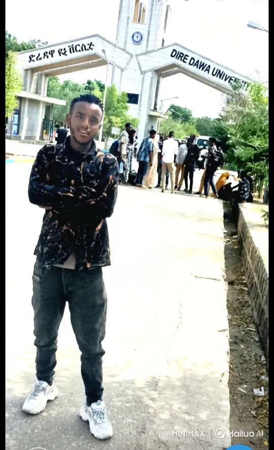 Young Man Poses at Dire Dawa University Entrance – AI Generated Video | Hailuo AI