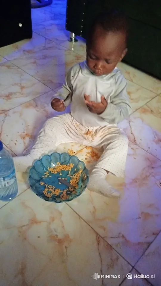 Toddler Enjoying Messy Meal on Marbled Floor – AI Generated Video | Hailuo AI
