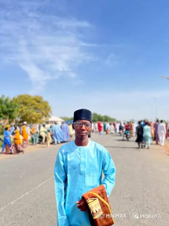 Young Man in Blue Stands Calmly Amidst Crowded Road – AI Generated Video | Hailuo AI
