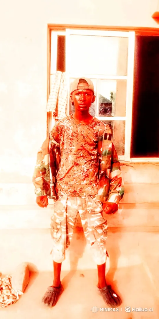 Young Person in Camouflage Stares Intently at Camera – AI Generated Video | Hailuo AI