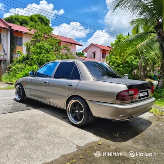 Beige Sedan Lowering on Cracked Driveway – AI Generated Video | Hailuo AI