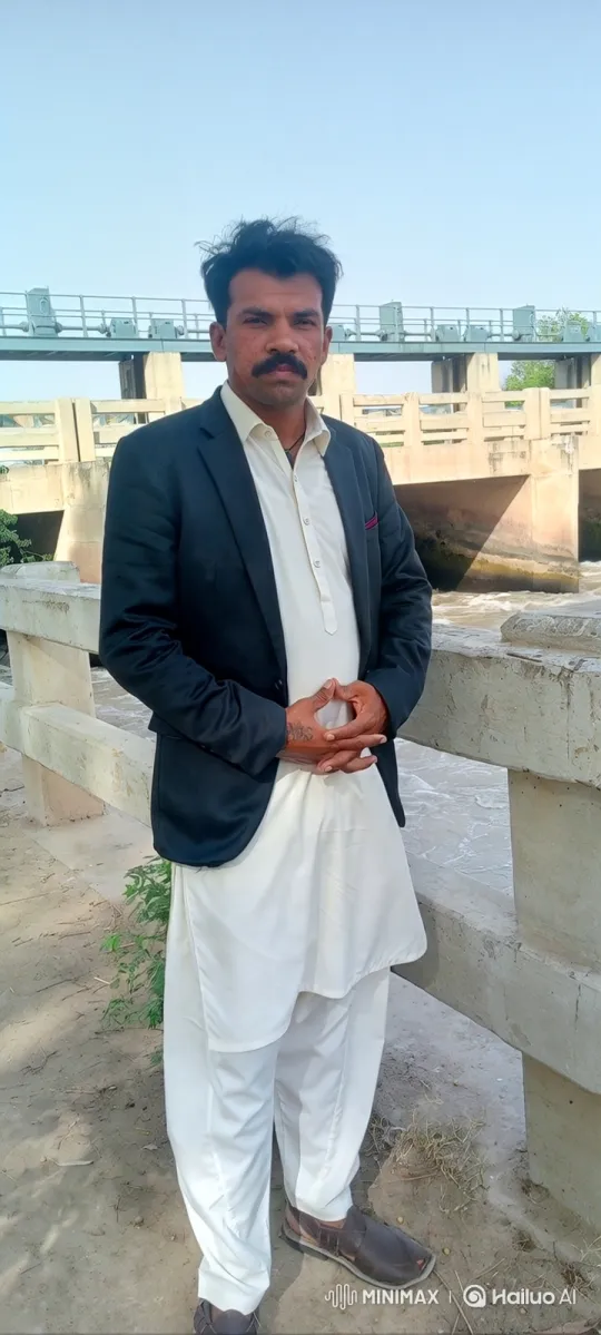 Man in White Stands by Dam, Gazes Steadily – AI Generated Video | Hailuo AI
