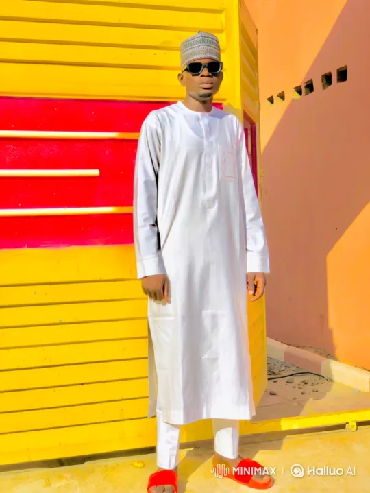 Confident Man in White Outfit Poses for Slow Close-Up – AI Generated Video | Hailuo AI