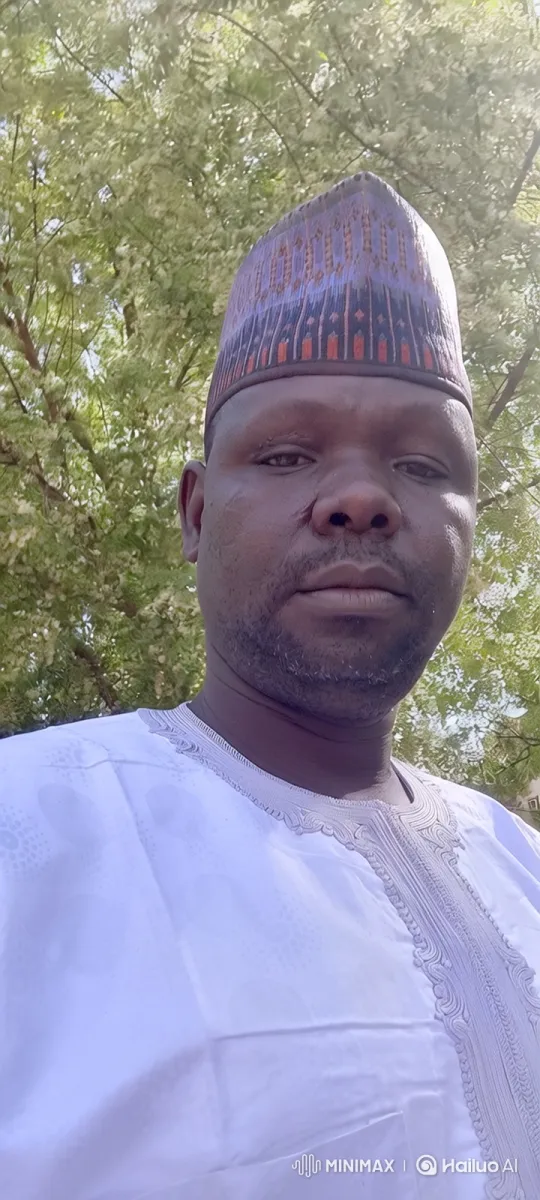 Man in White Embroidered Garb Amidst Blossoming Tree – AI Generated Video | Hailuo AI