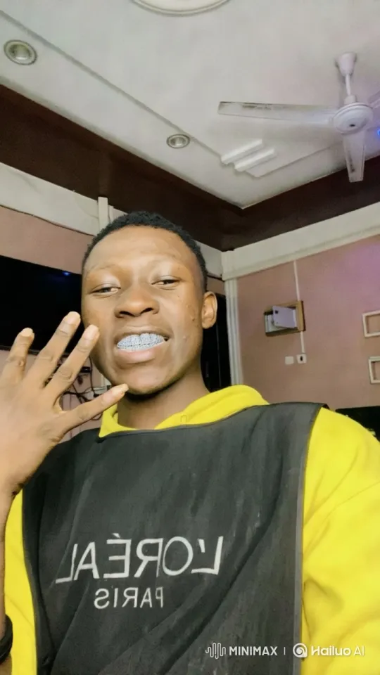 Young Man Showcases Braces in Bright L'Oréal-Themed Room – AI Generated Video | Hailuo AI