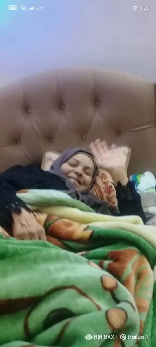 Elderly Woman Greets and Blows Kiss from Bed – AI Generated Video | Hailuo AI