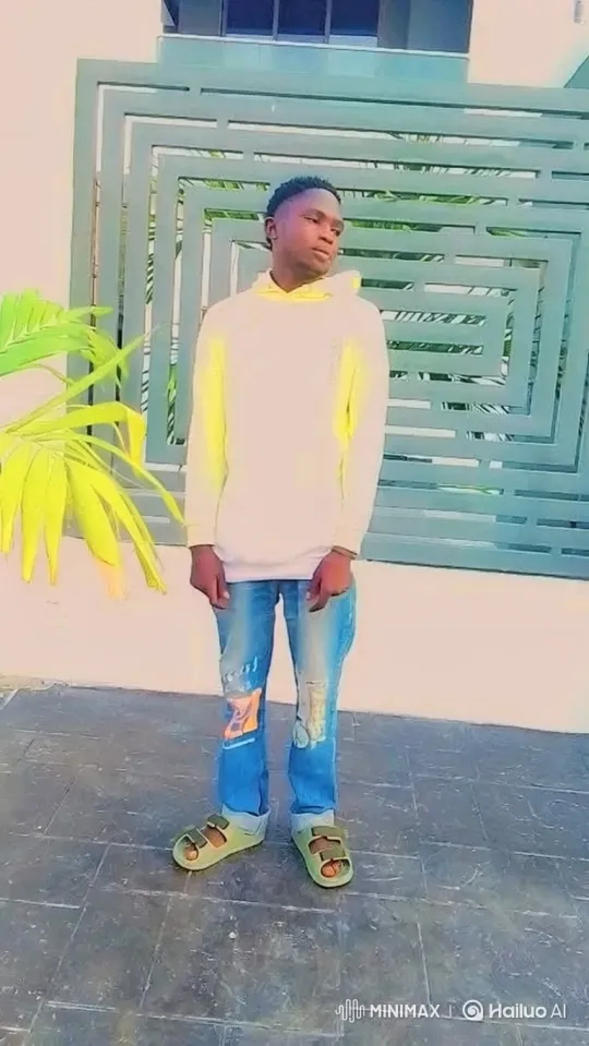 Young Man Smiles on Patio in Neutral Outfit – AI Generated Video | Hailuo AI